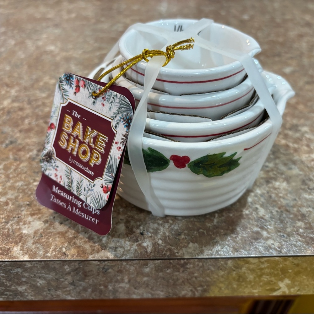 The Bake Shop Measuring Cups with Holly design NWT excellent condition.
